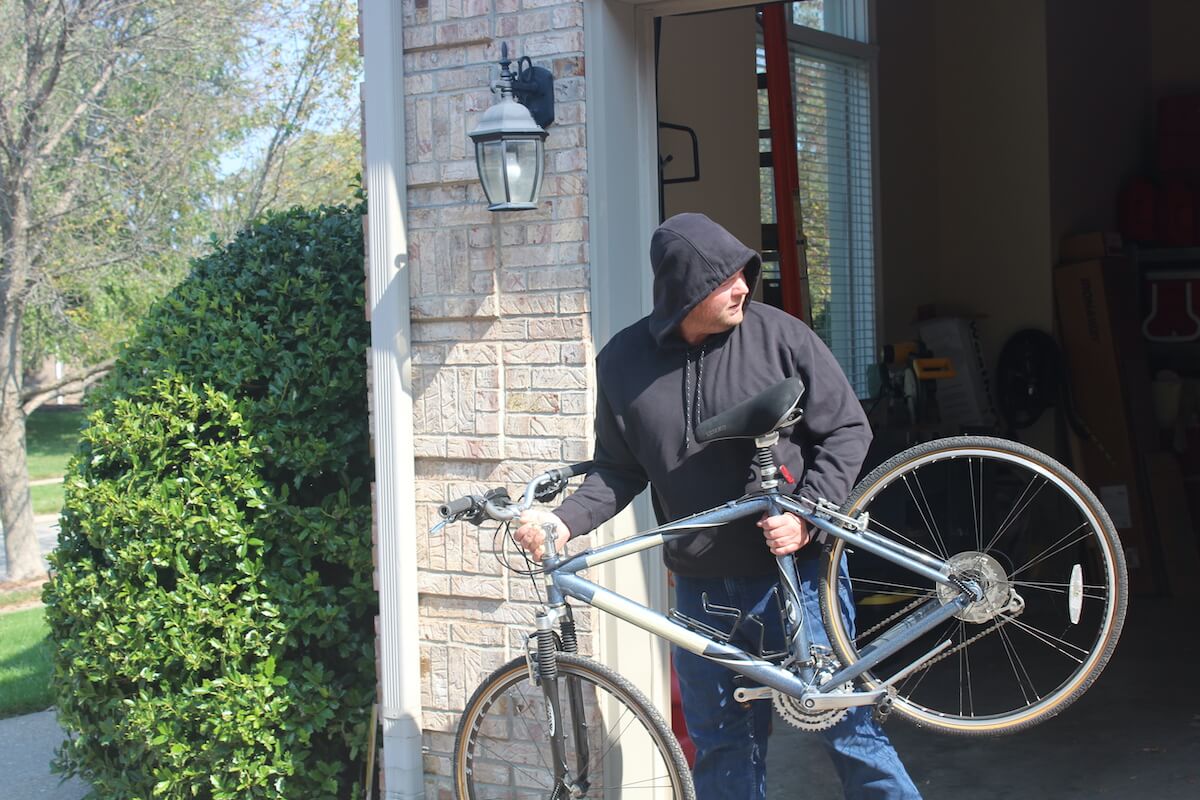man stealing bicycle